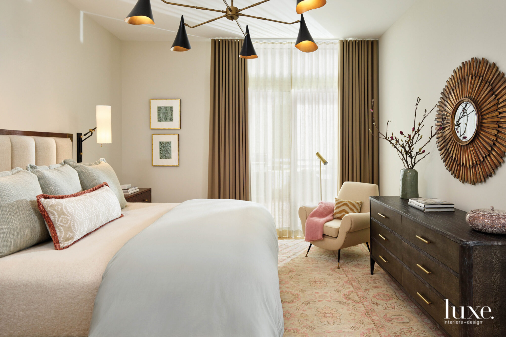 The clients' bedroom is decorated in shades of cream and blush with vintage furniture.