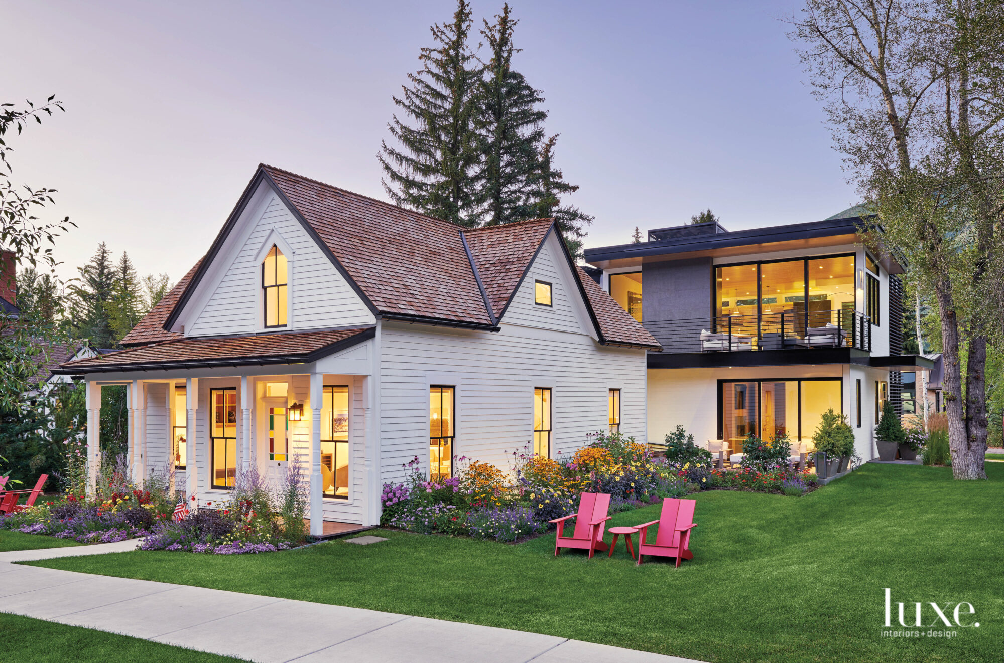 In front of the modern home sits a remodeled Victorian-era home.