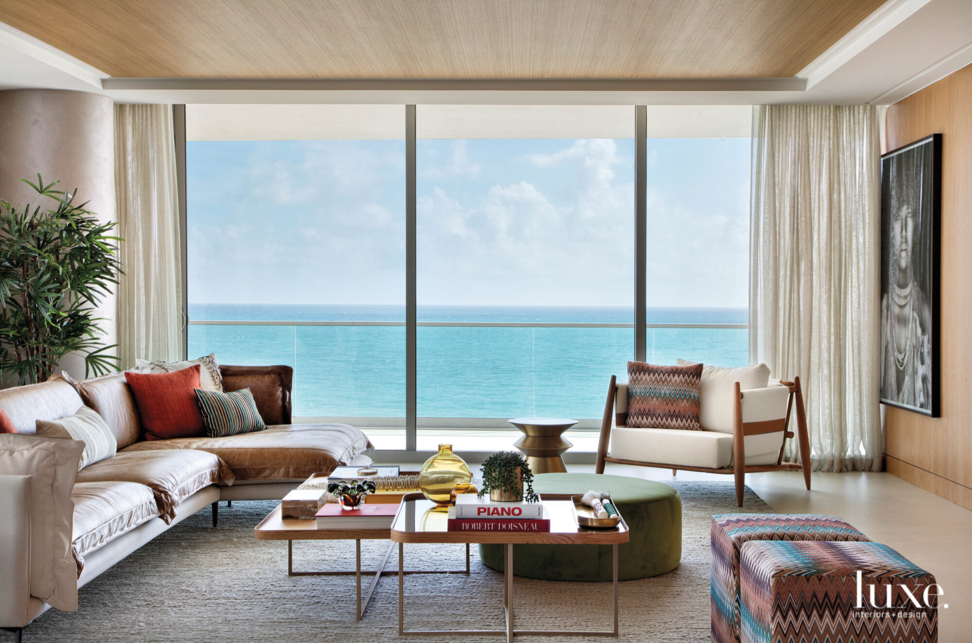 living room with mixed furnishings and ocean views