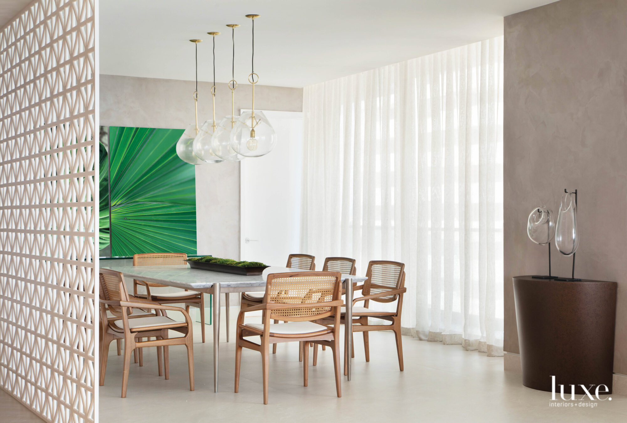 dining area with oak furniture and tropical artwork