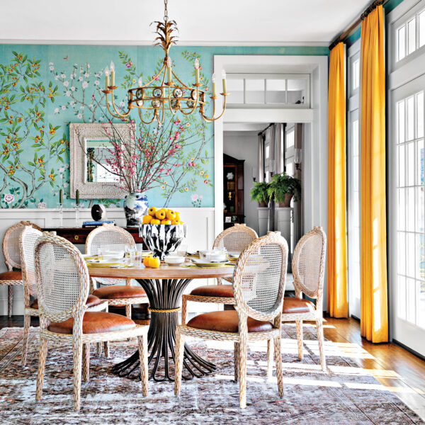 Breakfast room with floral wallpaper and. yellow draperies