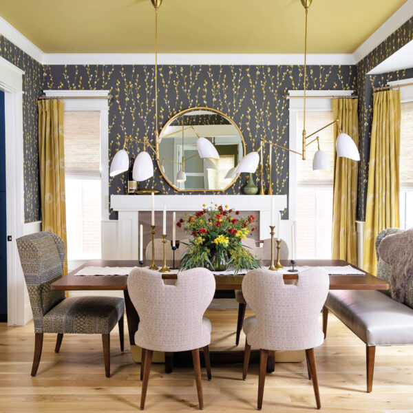 The dining room has a mustard yellow ceiling and gray-and-yellow wallpaper.