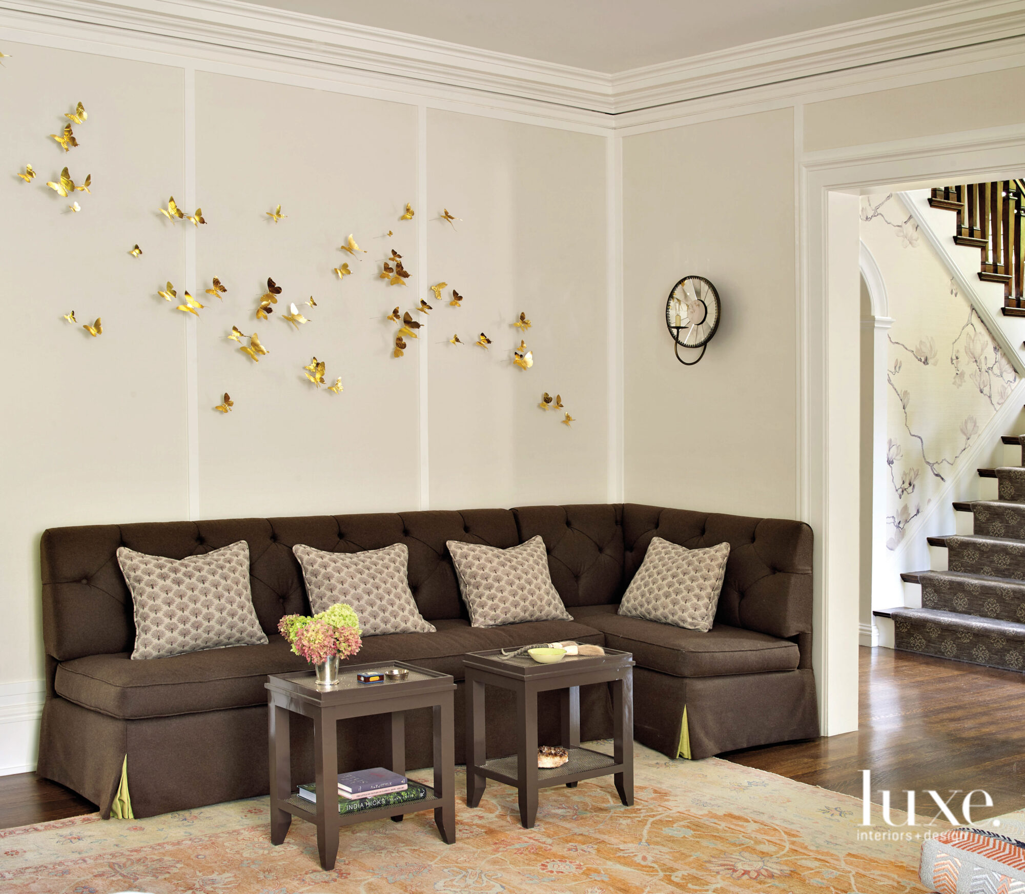A banquette is tucked into one corner of the living room.