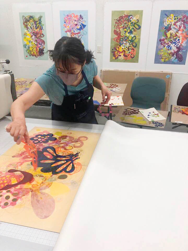 Artist working on colorful artwork