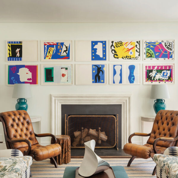 sitting area with leather armchairs and artwork