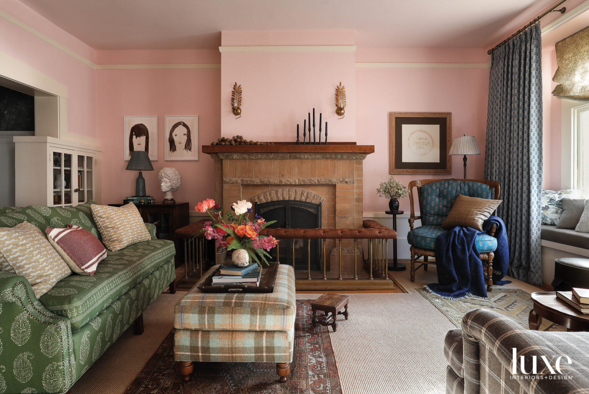 The living room is painted pink, and it has classic furniture.