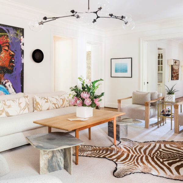 White living room with zebra print rug and bold abstract painting