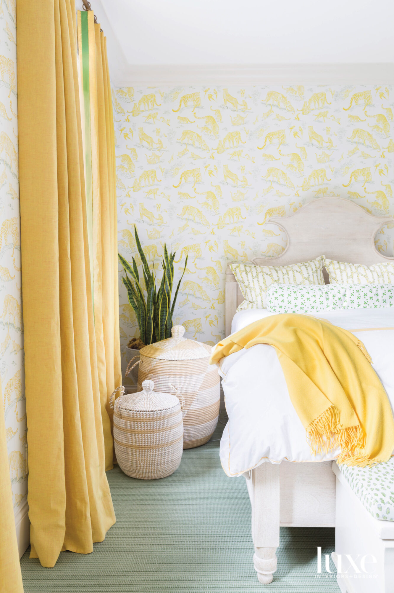 Photo of bed with yellow draperies and woven baskets