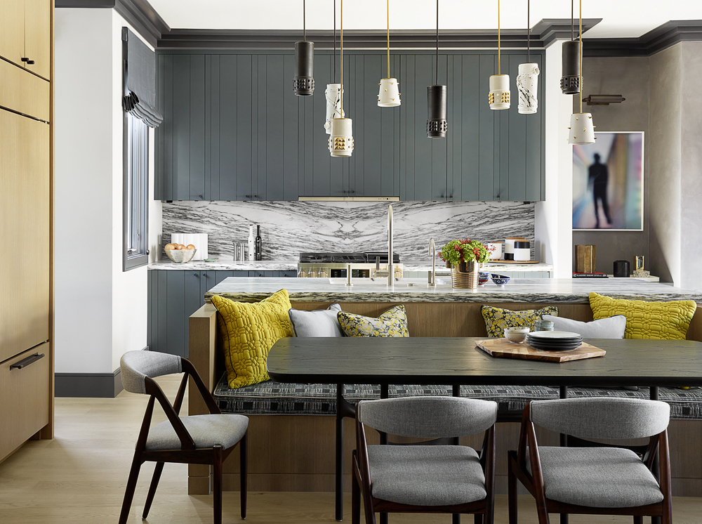 kitchen design with black table and cabinetry, marble backsplash and assortment of furnishings
