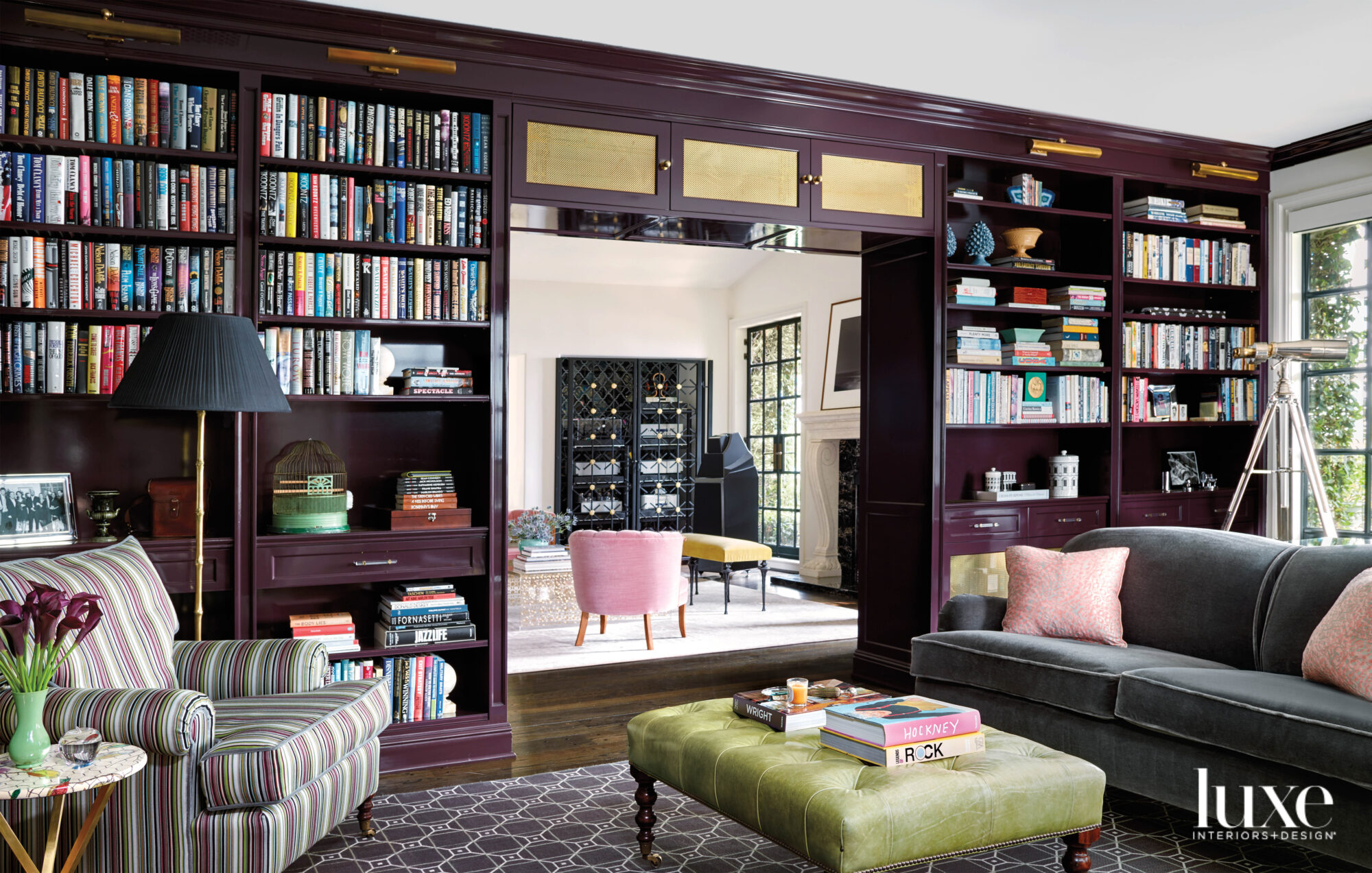 Library with purple painted shelving