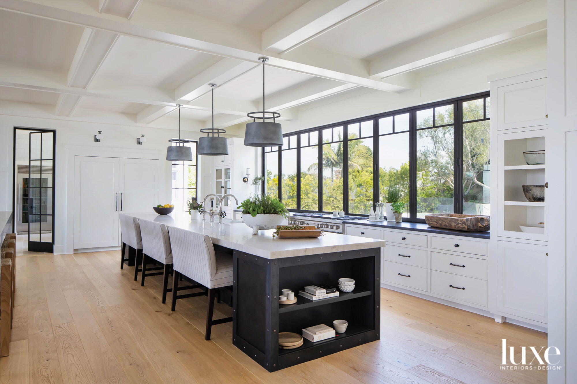 Kitchen view facing island and long windows