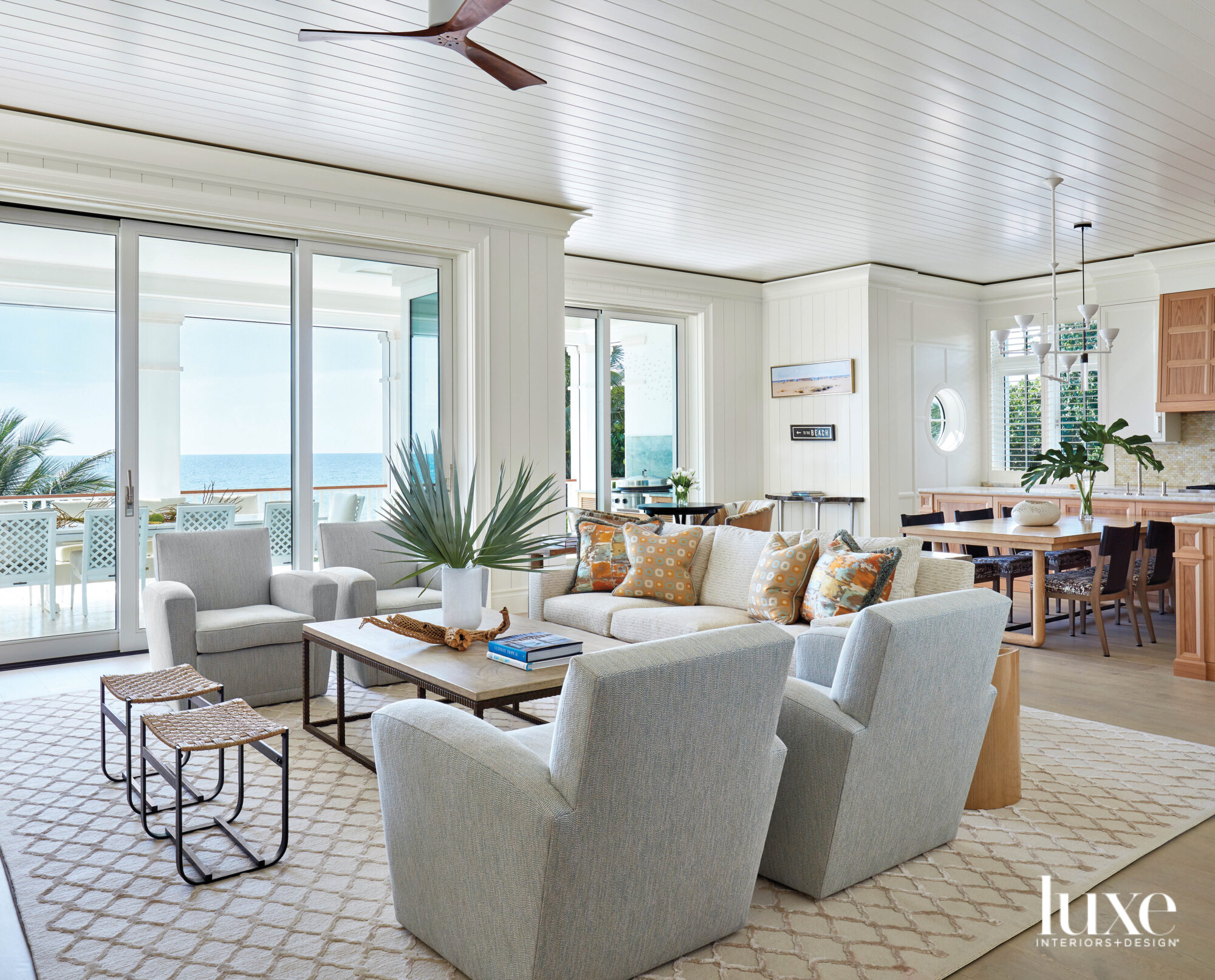 Living area with gray armchairs with ocean views.