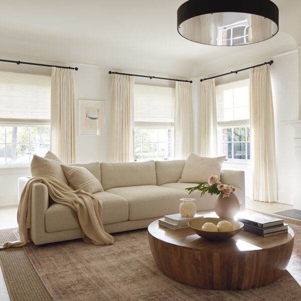 neutral living room with cream curtains and window treatments by gold list sponsor the shade store