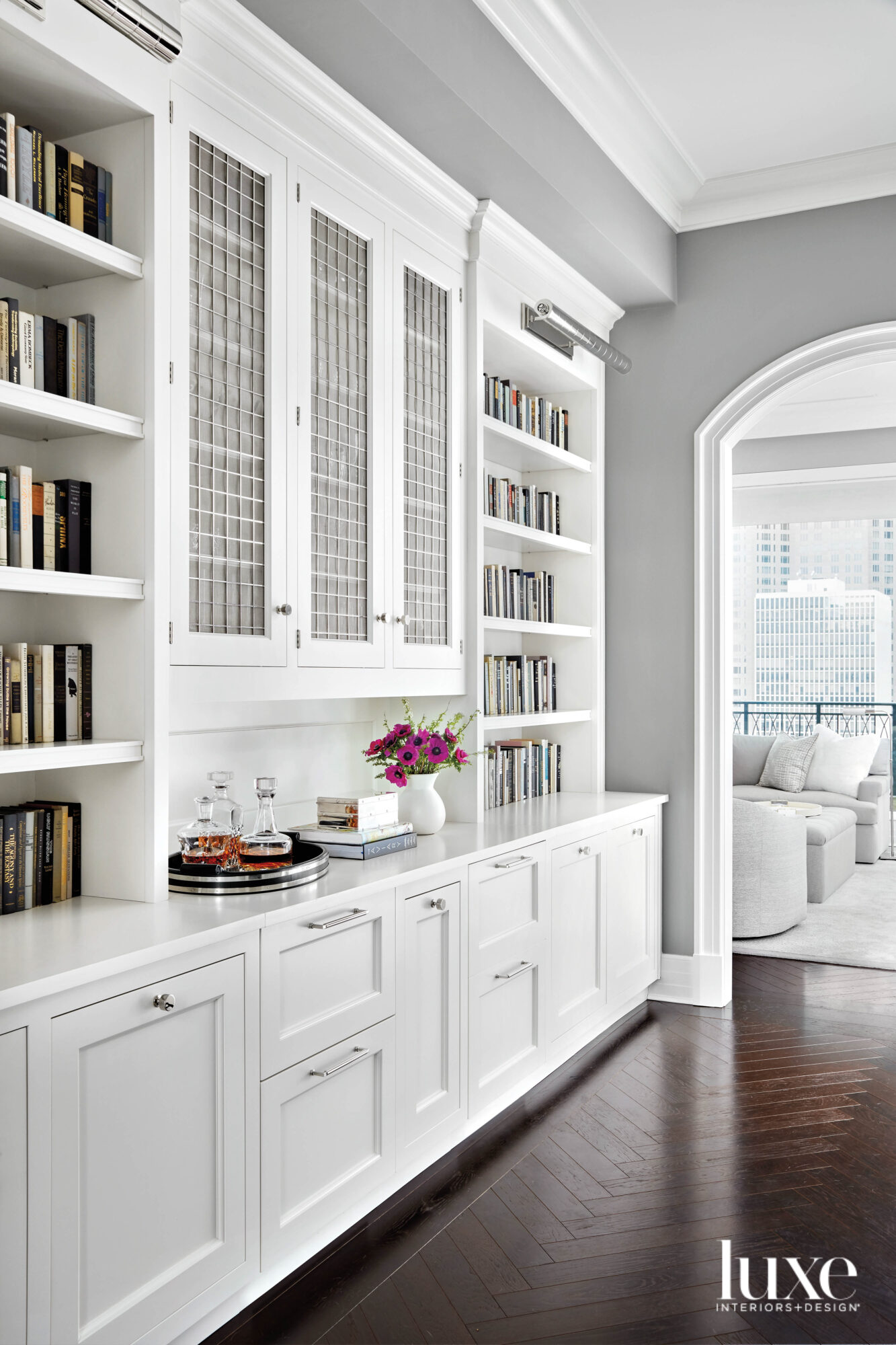 A white bookcase and cabinets.