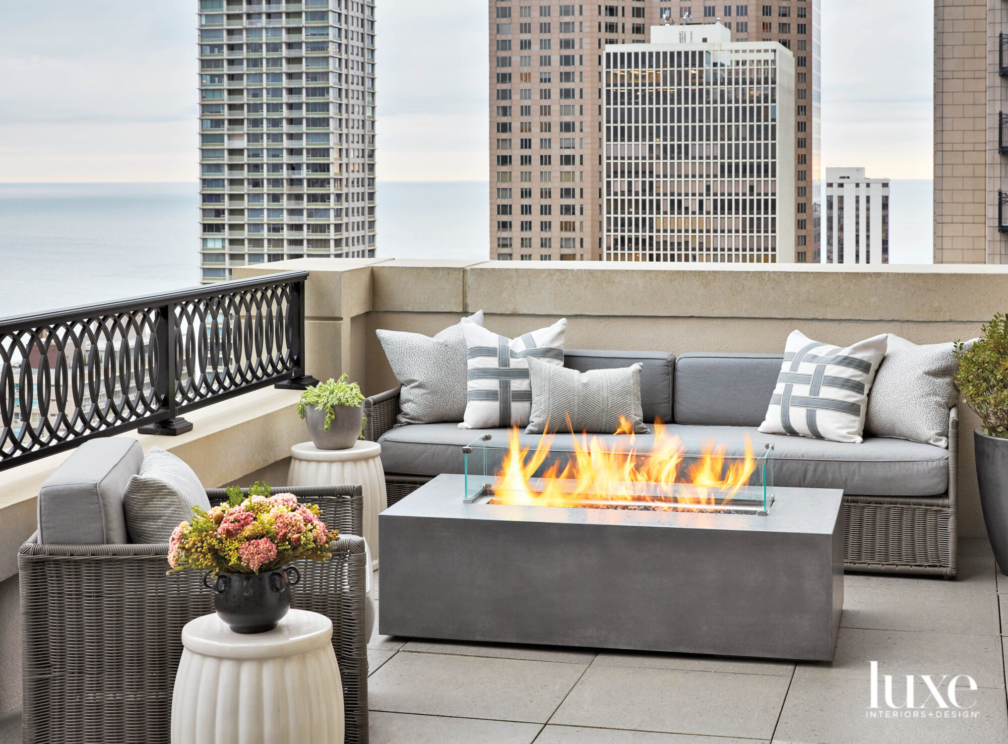 A balcony seating area overlooking Chicago skyline.