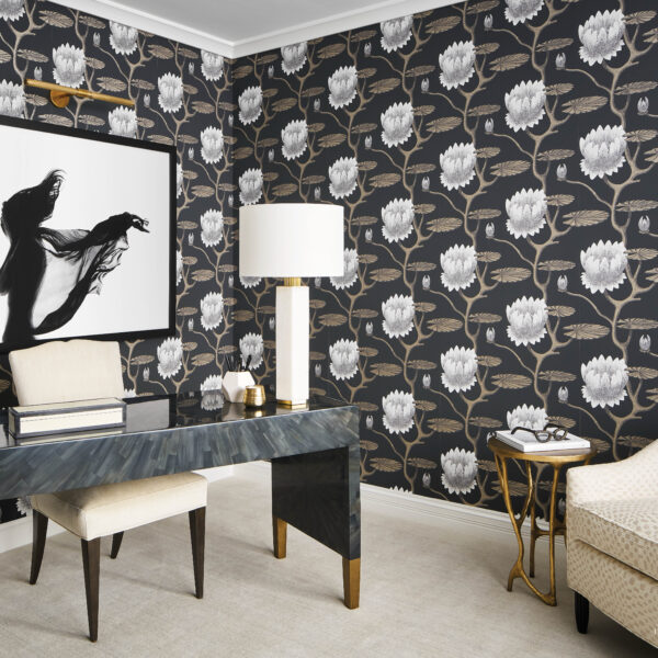 A Magnificent Mix Of Masculine And Glam Dignifies A Chicago High Rise A home office has a dramatic floral wallpaper. A black-and-white photograph hangs behind the desk.