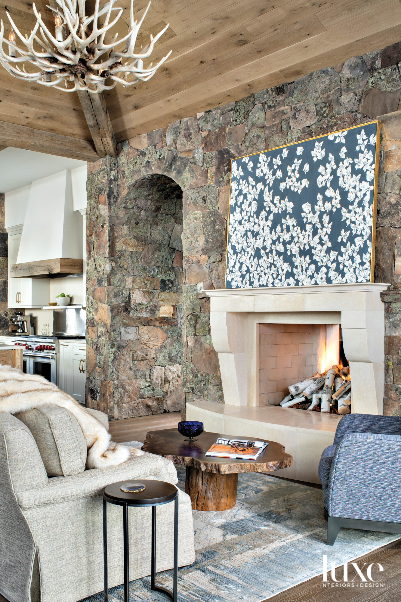 sitting room with stone walls and fireplace