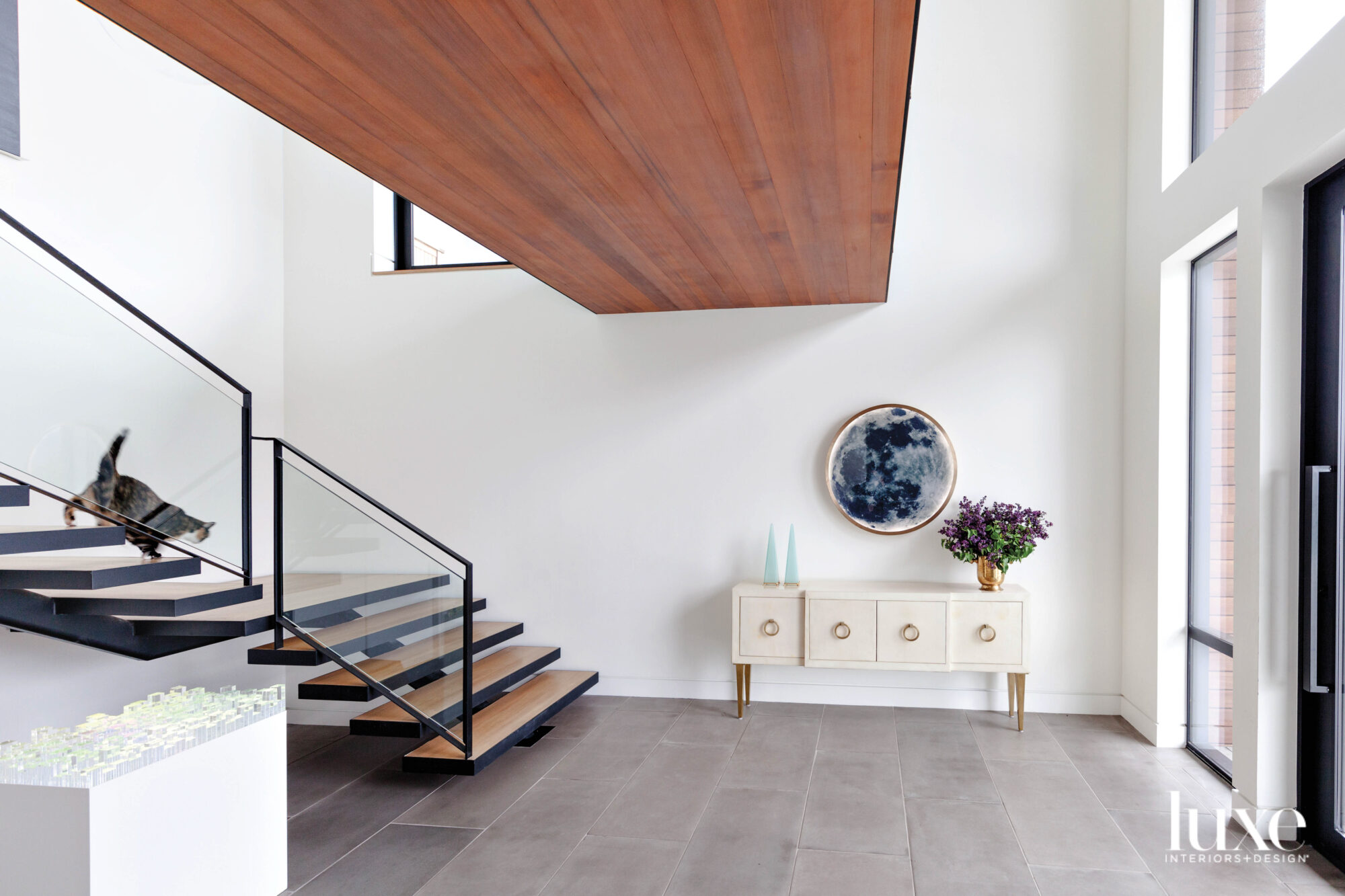 contemporary staircase entry with wall...