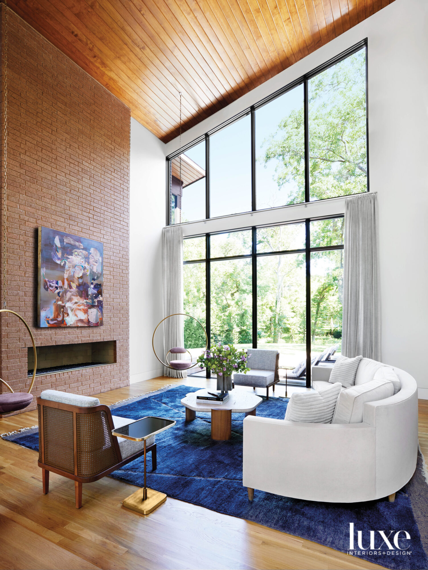 Living room featuring a Lee Broom Hanging Hoop chair and midcentury modern-style furnishings