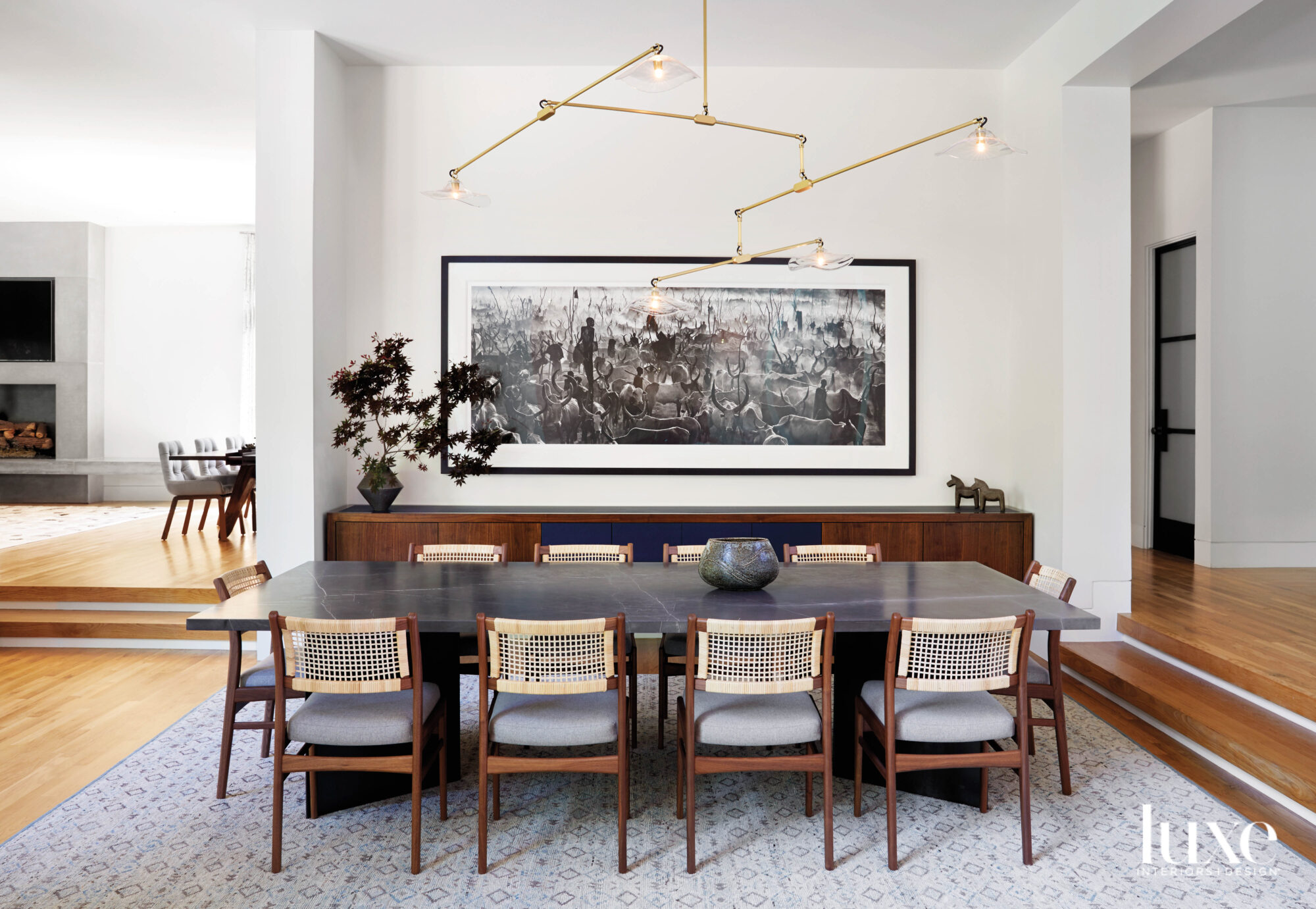 Dining room featuring a custom table and David Yarrow photography.
