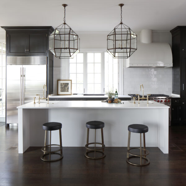 Custom wood flooring in a modern Kitchen with white countertops and pendant lighting by FireRock