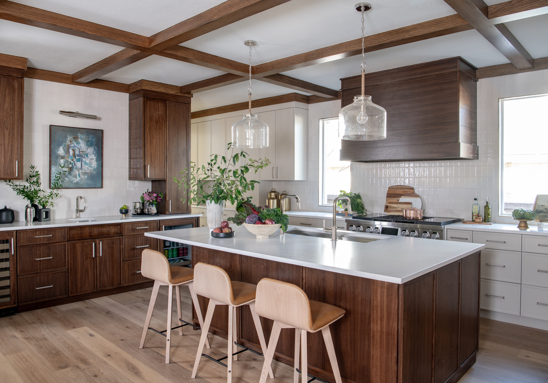 A kitchen with wood cabinets and a center island.