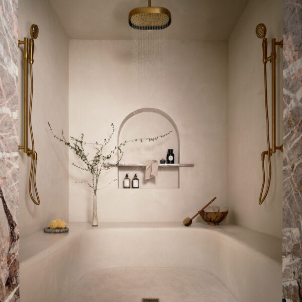 Walk-in master shower with elegant marble design.