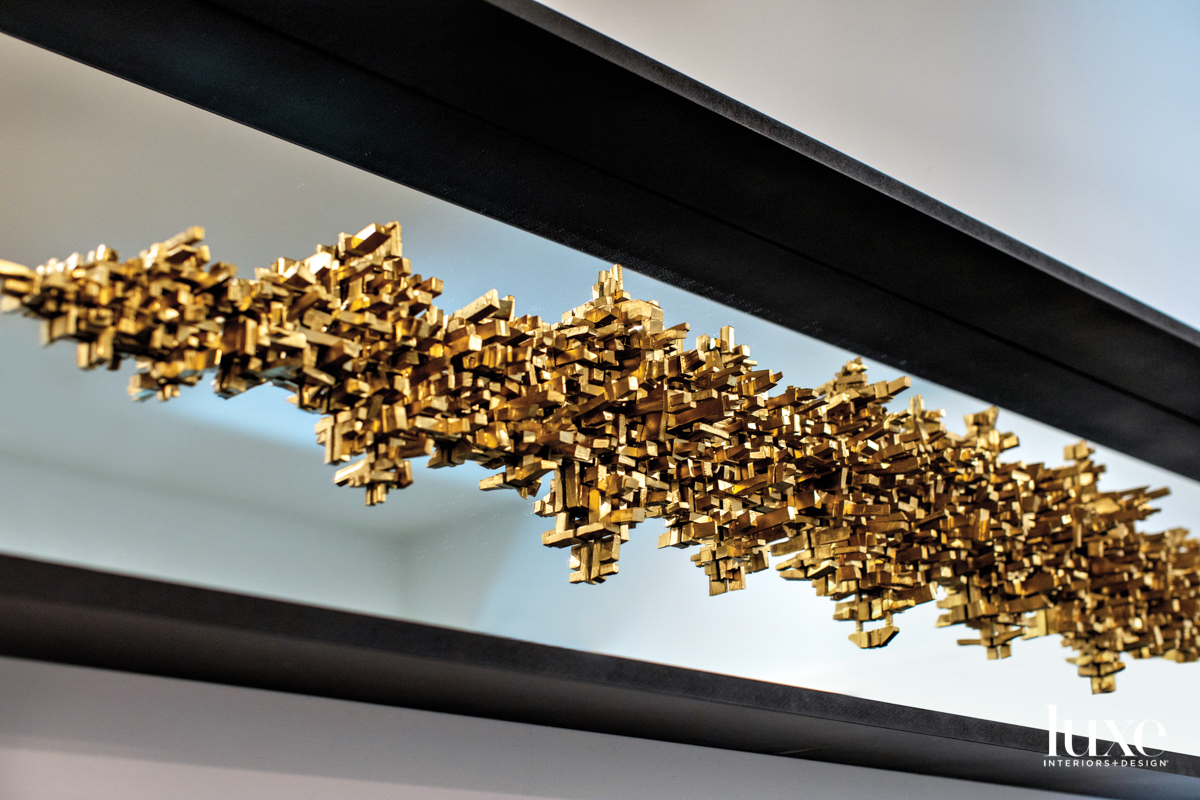 Small gold blocks connected into one large sculpture.