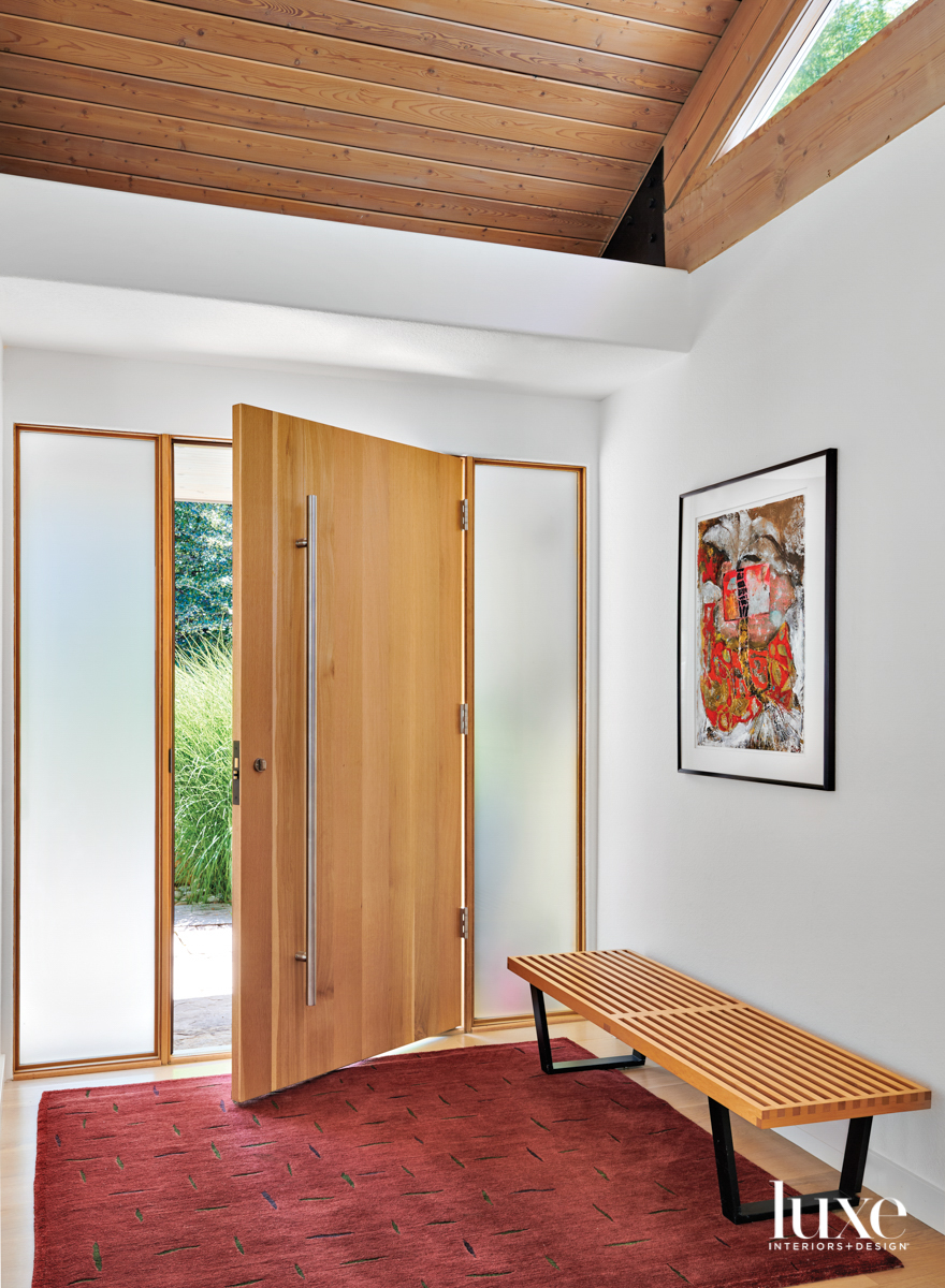 front door flanked by side windows and bench, designed by Mosaic Architects + Interiors
