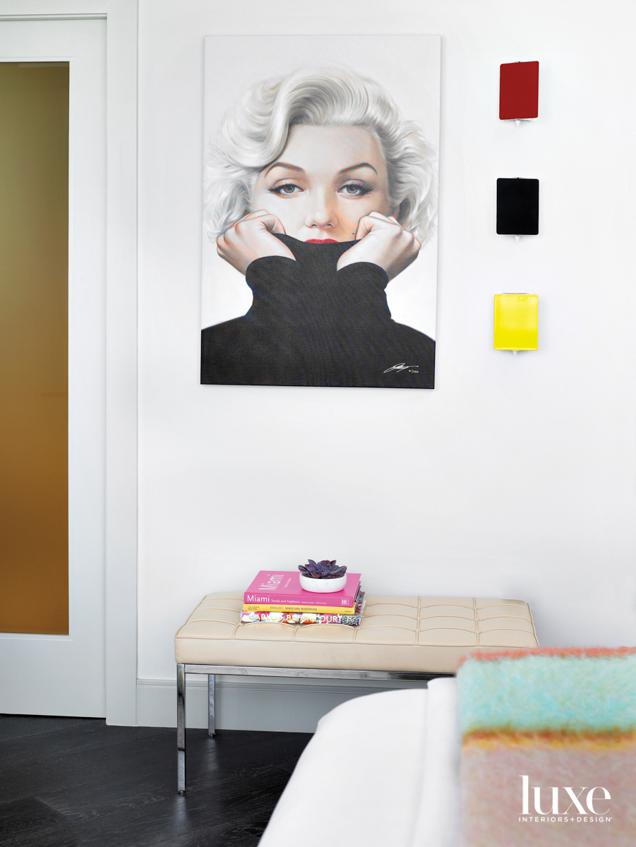 guest bedroom with bench and marilyn monroe artwork
