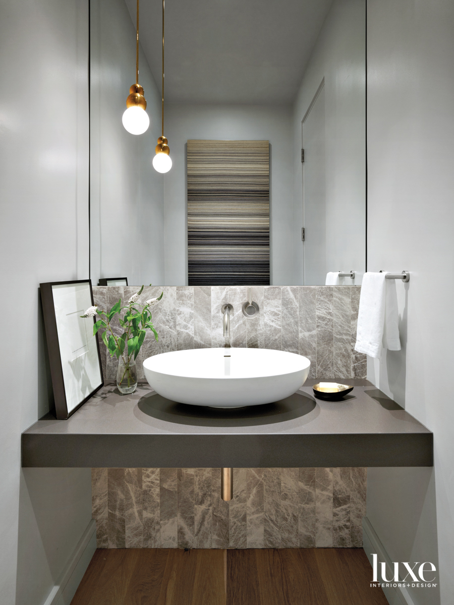 neutral powder room with basalt countertop