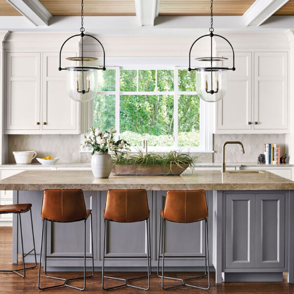 A Wilmette Home Delivers On A Wish For A More Laid-Back Lifestyle transitional gray kitchen island topped with tan quartz countertops