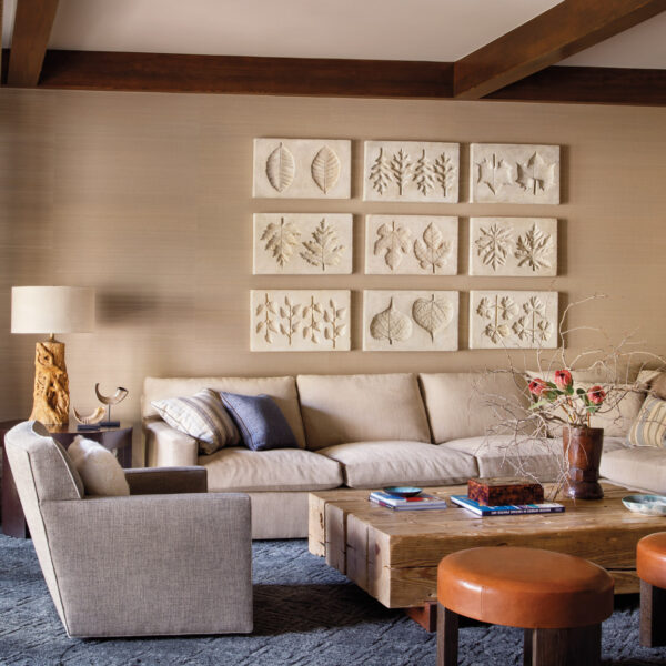 Joy Fills A Swiss Chalet-Inspired Colorado Home With Global Notes mountain-style family room features leaf impressions art series