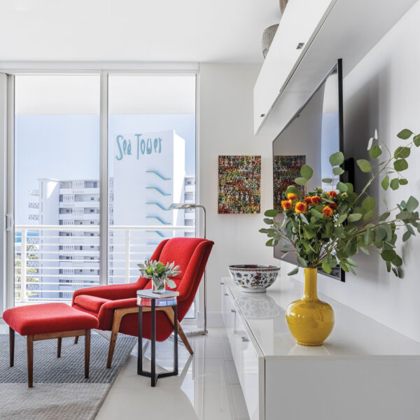 A Health-First Fort Lauderdale Haven Masters The Art Of The Pivot modern high-rise sitting area features red ottoman and shiny white flooring