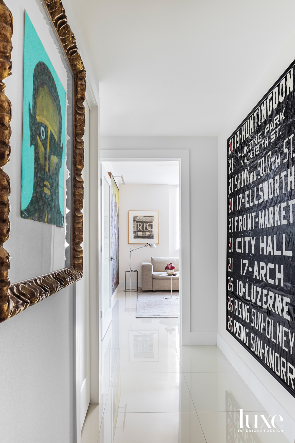 modern white hallway adorned with eclectic artwork