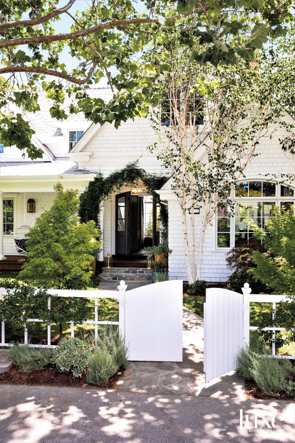 The exterior of a traditional Menlo Park home is painted white.