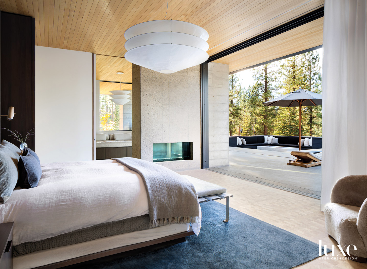 In the main zen bedroom, a bed faces the view.