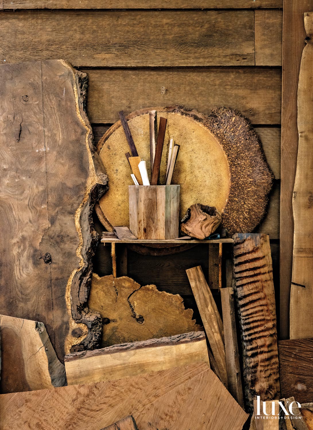 Wood pieces are displayed in an artist's studio.