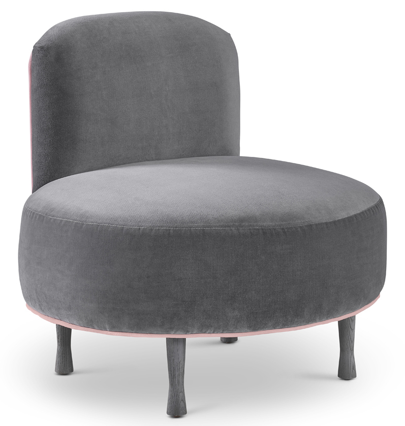 grey velvet slip over an armchair with a pink trim