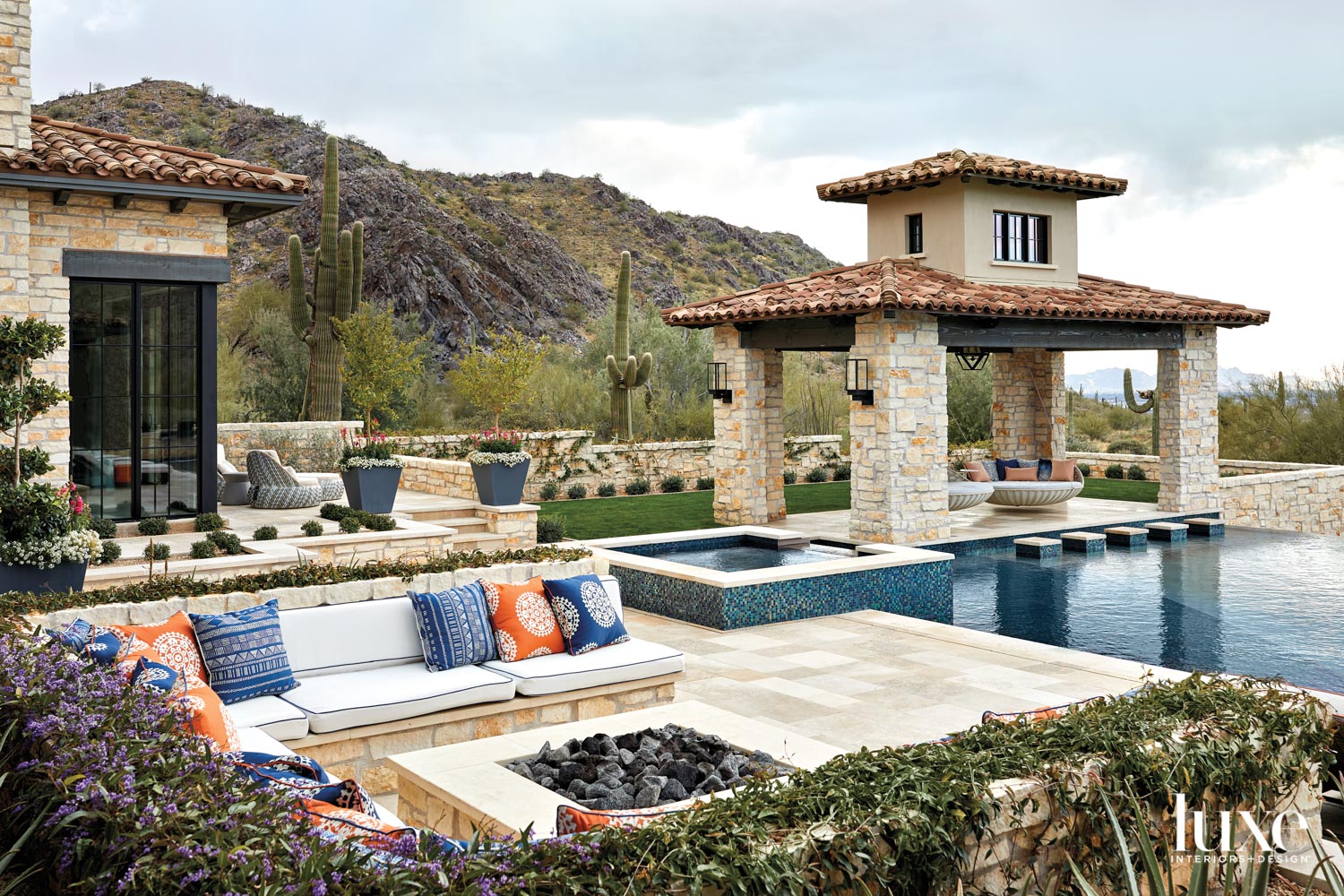 A poolside patio with a...