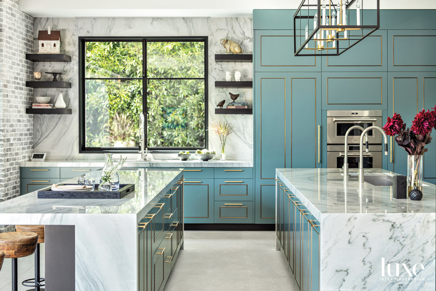 Kitchen featuring blue painted cabinetry...