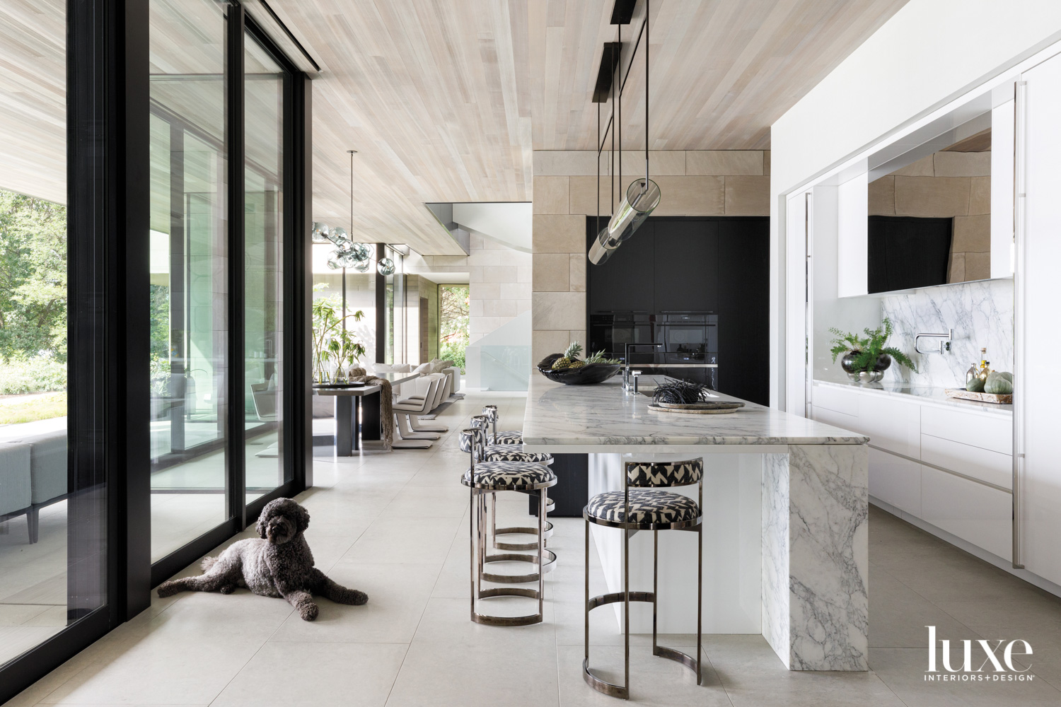 A gray-white-and-black kitchen with high-gloss...