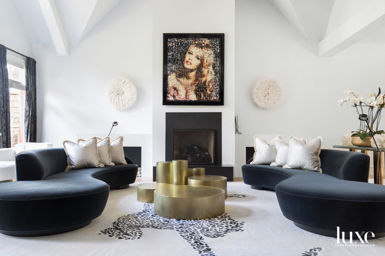 An elegant living room features a portrait of Bridgette Bardot.