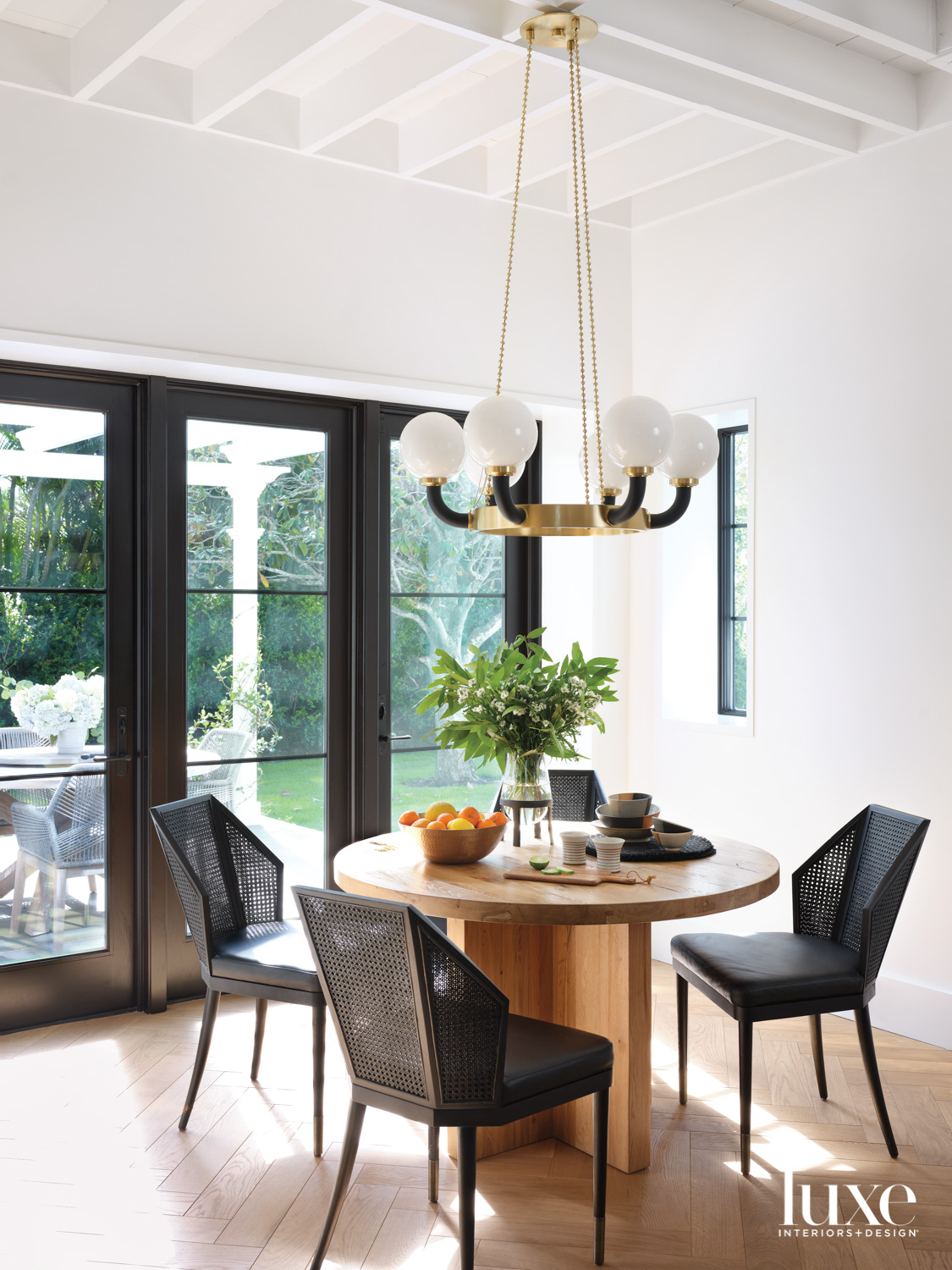 breakfast area with black chairs,...