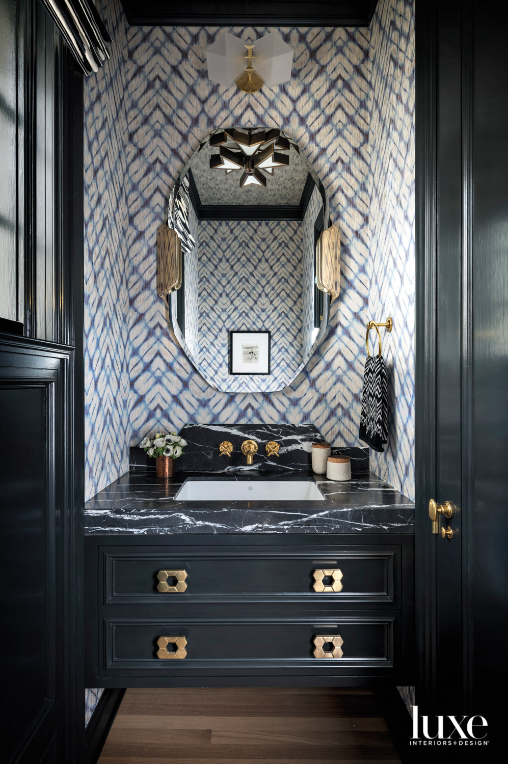 Powder room with marble topped...