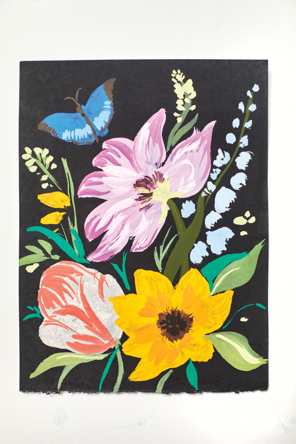 Floral painting with butterfly against a black background