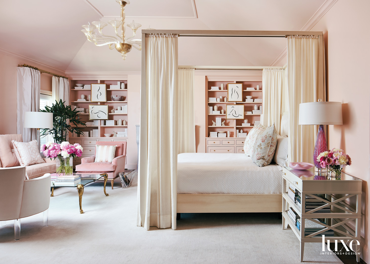 Barbiecore interior design bedroom with pale pink walls and bookshelves