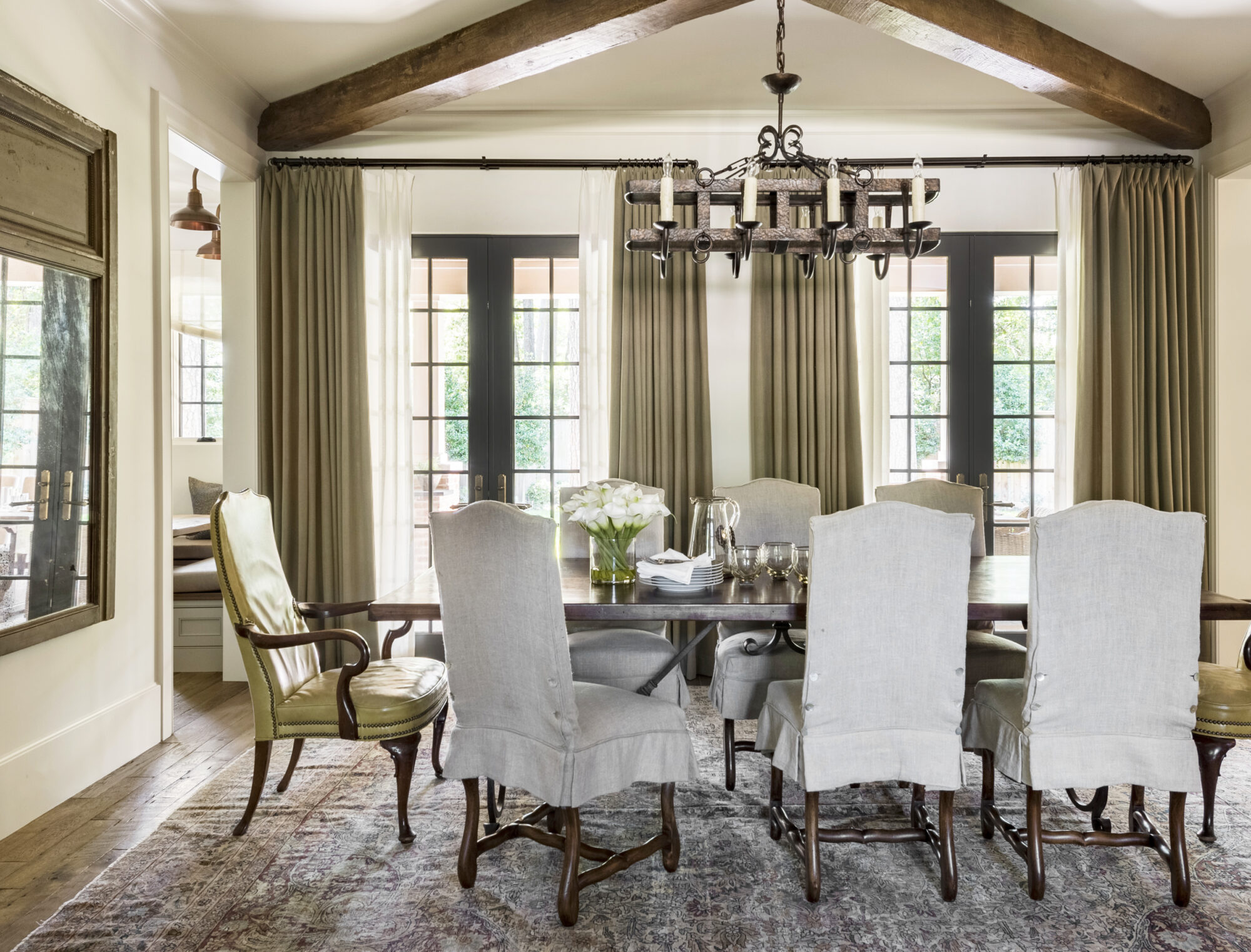traditional neutral dining room gray side chairs green host chairs gray rug