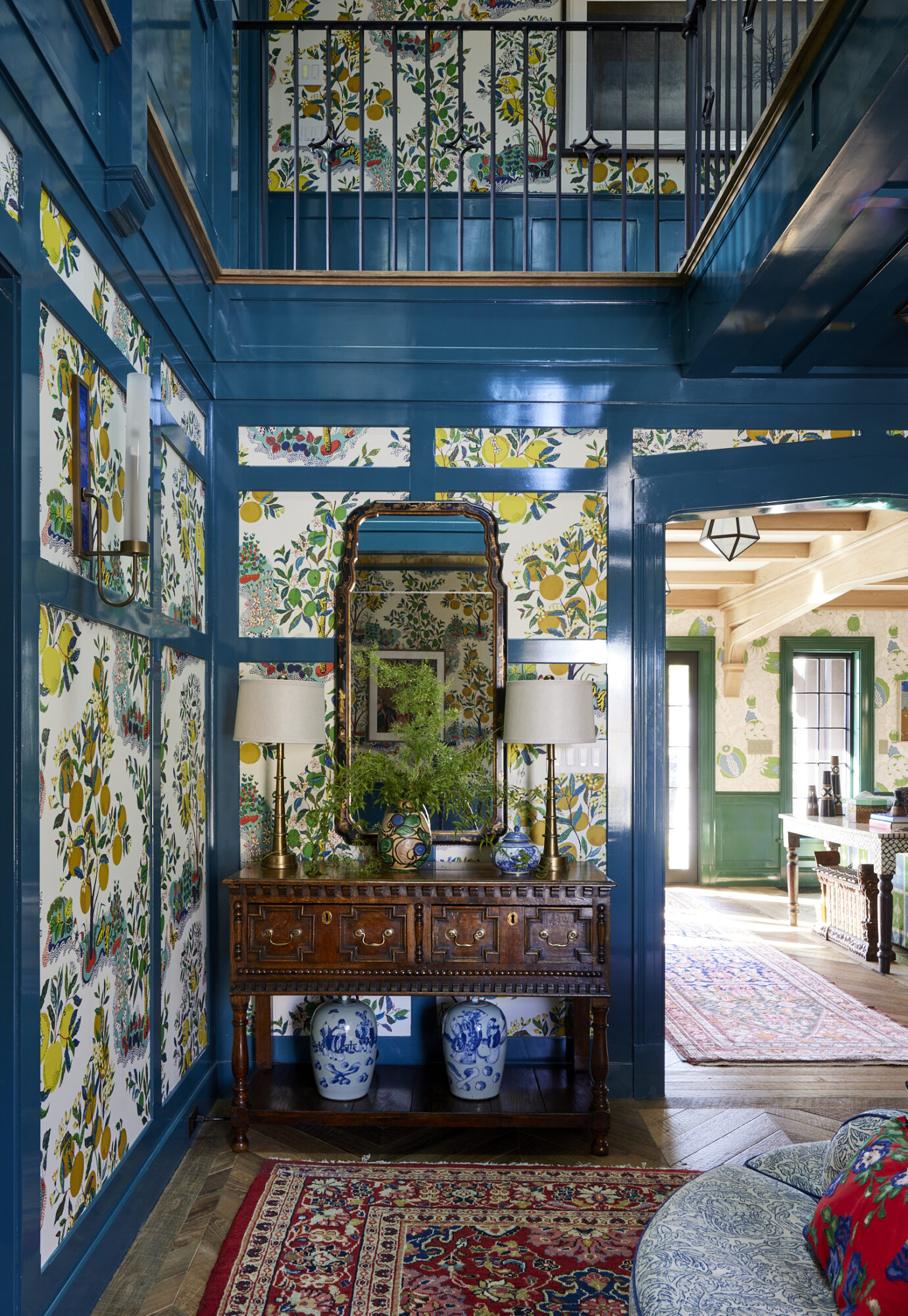 teal lacquered entryway with botanical wallpaper