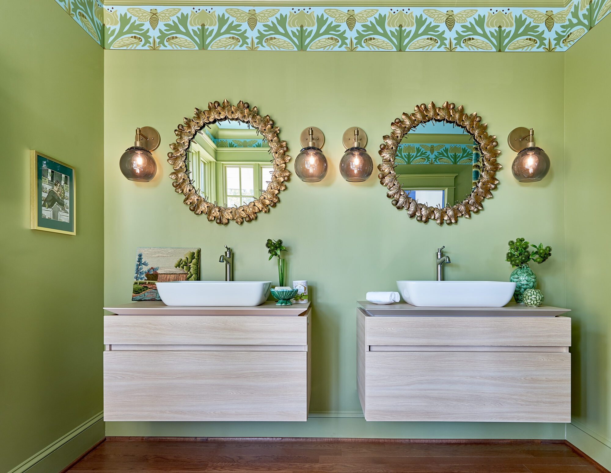 bright green bathroom with gold detail and nature motif